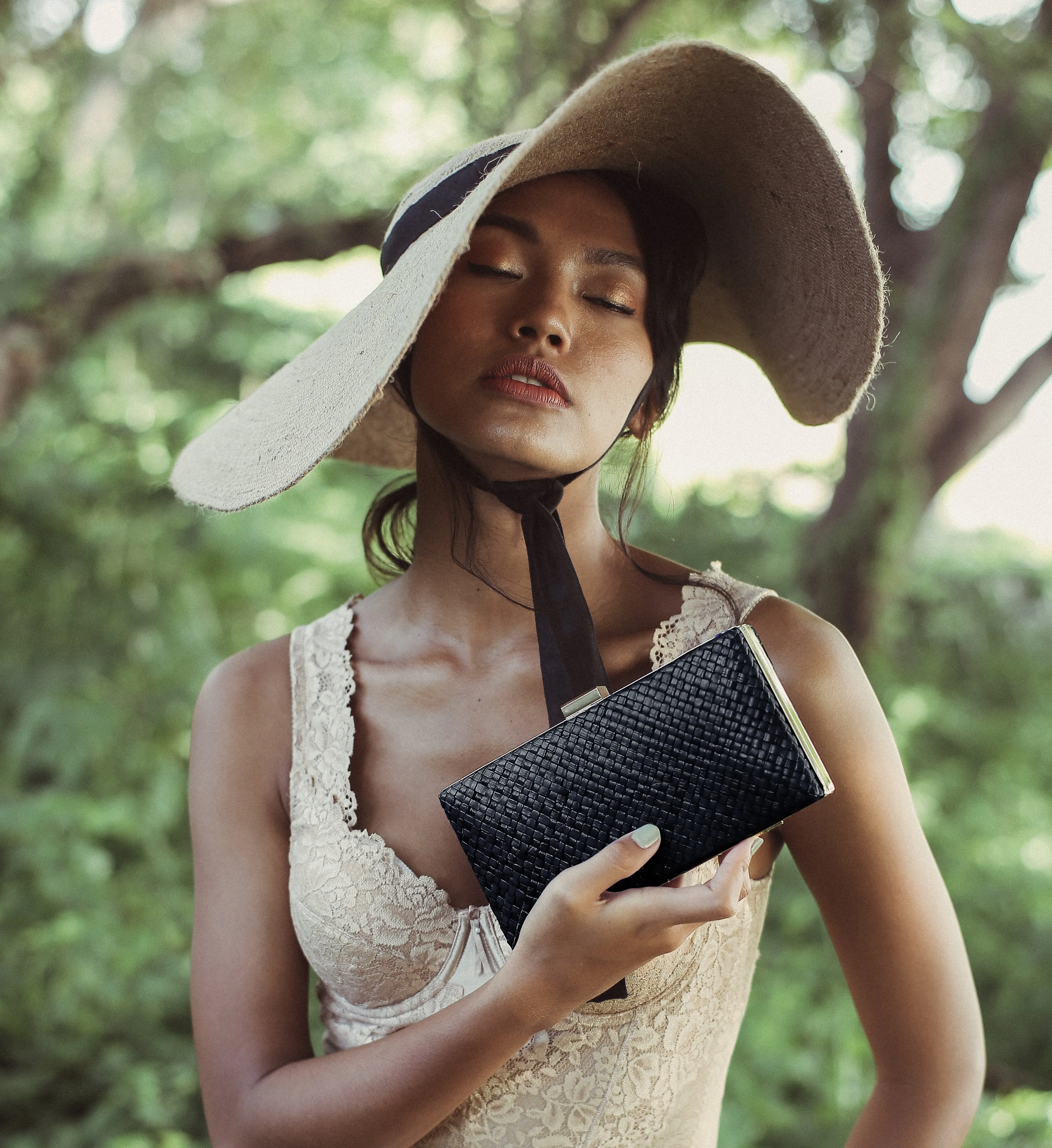 Gitta Jett Black Handwoven Straw Clutch